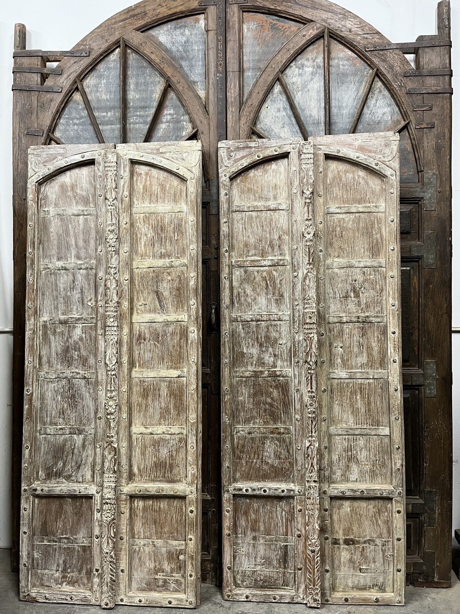 Incorporating Antique Carved Barn Doors into a Spanish-Style Farmhouse