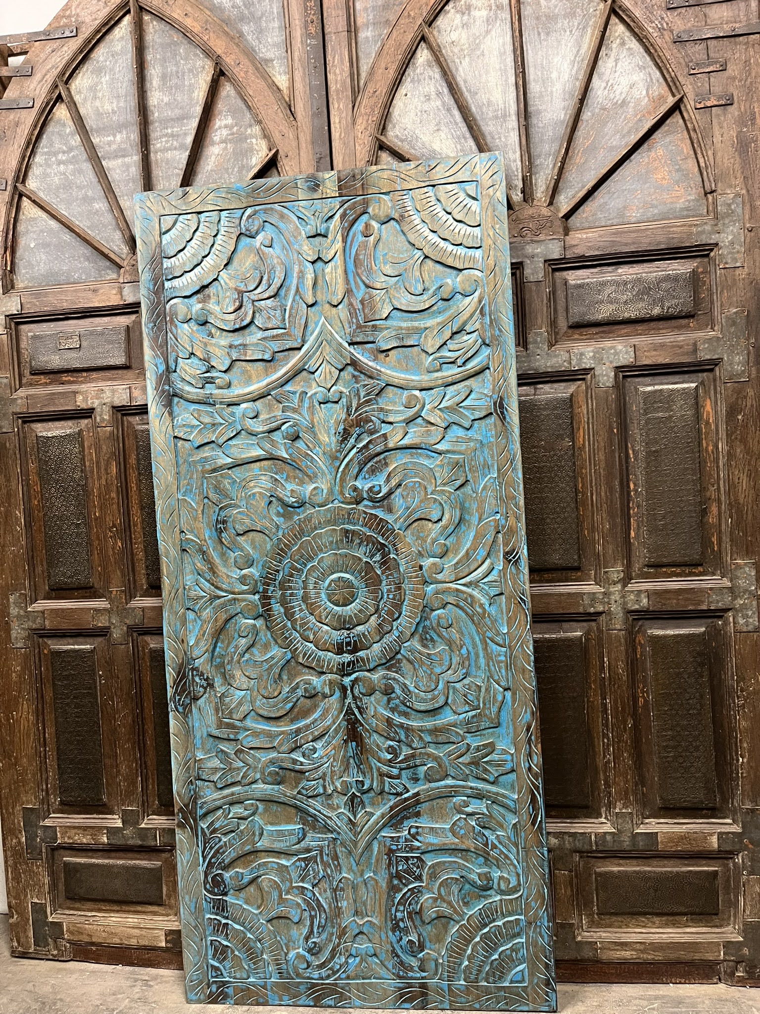 Artful Divides: Carved Doors as Functional Statements in Modern Interiors